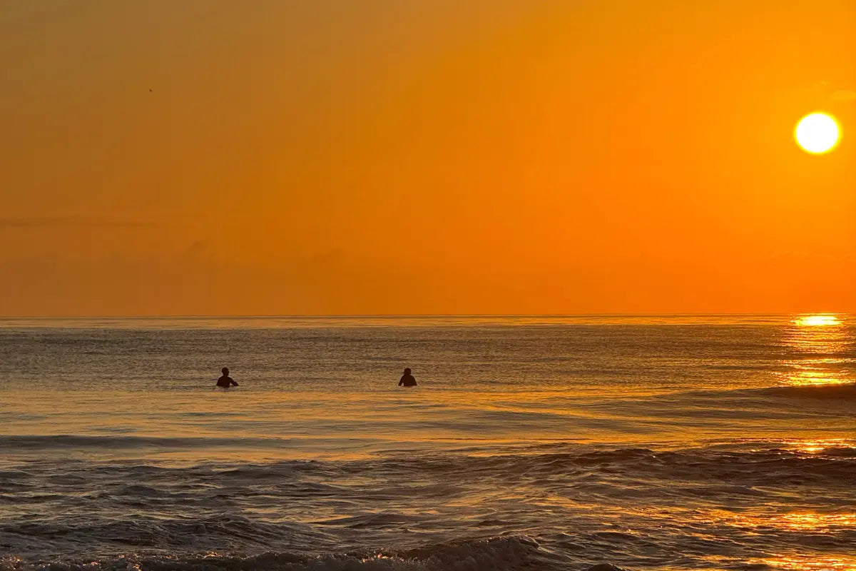 Surfers in the water at Cocoa Beach Florida